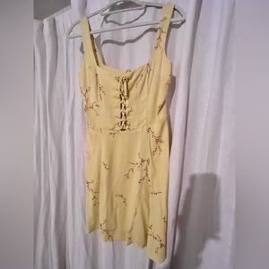 Reformation Yellow Floral mini dress with lace up front